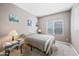 Cozy bedroom with comfortable bed, accent paintings and natural light at 2156 W Periwinkle Way, Chandler, AZ 85248