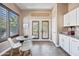 Breakfast nook with french doors and large window allowing for natural light at 2156 W Periwinkle Way, Chandler, AZ 85248