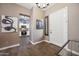 Inviting entryway with stylish decor and an open view into the adjacent kitchen space at 2156 W Periwinkle Way, Chandler, AZ 85248