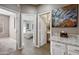 Bright hallway with neutral tones leads to bedroom and bathroom at 2156 W Periwinkle Way, Chandler, AZ 85248