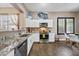 Bright kitchen featuring granite countertops, stainless steel appliances, and a cozy breakfast nook at 2156 W Periwinkle Way, Chandler, AZ 85248
