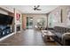 Inviting living room with a stone fireplace and a view of the outdoor pool area at 2156 W Periwinkle Way, Chandler, AZ 85248