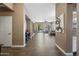 Spacious living room with tile flooring, neutral walls, and open floor plan leading to the backyard at 2156 W Periwinkle Way, Chandler, AZ 85248