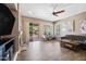 Living room with a ceiling fan, tile floors, and sliding glass doors that lead to a swimming pool at 2156 W Periwinkle Way, Chandler, AZ 85248