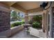 Charming covered patio with a table and chairs, perfect for outdoor relaxation at 2156 W Periwinkle Way, Chandler, AZ 85248