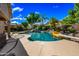 Gorgeous pool area featuring a rock waterfall, lush landscaping, and plenty of space for lounging and entertaining at 2156 W Periwinkle Way, Chandler, AZ 85248
