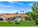 Aerial view of estate with a pool, guest house, well manicured grounds and mature landscaping at 2339 E Virgo Pl, Chandler, AZ 85249