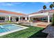 Expansive backyard boasts a pool, spa, fire pit, and outdoor kitchen perfect for entertaining at 2339 E Virgo Pl, Chandler, AZ 85249