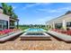 Scenic backyard showcases a pool, fire pit, seating, and manicured landscaping for ultimate relaxation at 2339 E Virgo Pl, Chandler, AZ 85249