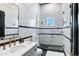 Bright bathroom with tiled shower, modern vanity, and designer fixtures at 2339 E Virgo Pl, Chandler, AZ 85249