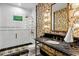 Stylish bathroom featuring patterned wallpaper, a marble countertop, and glass enclosed shower at 2339 E Virgo Pl, Chandler, AZ 85249