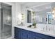 Luxury bathroom showcases marble countertops, double sinks, navy cabinets, and a glass shower at 2339 E Virgo Pl, Chandler, AZ 85249