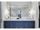 Elegant bathroom features marble countertops, double sinks, and stylish navy blue cabinetry at 2339 E Virgo Pl, Chandler, AZ 85249