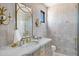 Bright bathroom features white marble counters, unique gold hardware, and a glass shower at 2339 E Virgo Pl, Chandler, AZ 85249