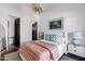 Cozy bedroom featuring a comfortable bed, decorative artwork, and neutral tones at 2339 E Virgo Pl, Chandler, AZ 85249