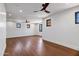 Large bonus room with hardwood floors, recessed lighting, and dark-trimmed windows at 2339 E Virgo Pl, Chandler, AZ 85249