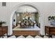 Elegant dining room featuring a large oval table, designer wallpaper and an ornate chandelier at 2339 E Virgo Pl, Chandler, AZ 85249