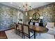 Formal dining room with a large table, designer wallpaper, buffet and chandelier at 2339 E Virgo Pl, Chandler, AZ 85249