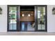 An indoor/outdoor flex room with wood paneling, black trim and plenty of natural light at 2339 E Virgo Pl, Chandler, AZ 85249