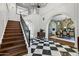 Spacious foyer with checkerboard floors, a staircase, and access to the formal dining area at 2339 E Virgo Pl, Chandler, AZ 85249