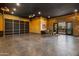Spacious garage with epoxy floors, wood paneled walls, dark ceilings, and custom lighting at 2339 E Virgo Pl, Chandler, AZ 85249