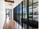 Hallway with wood floors and large glass windows offering a view of the pool at 2339 E Virgo Pl, Chandler, AZ 85249