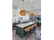 Gourmet kitchen with a large island, stainless steel appliances, and green cabinets, perfect for cooking and entertaining guests at 2339 E Virgo Pl, Chandler, AZ 85249