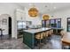 Spacious kitchen with a large island, marble countertops, stainless steel appliances, and green cabinets, perfect for cooking at 2339 E Virgo Pl, Chandler, AZ 85249