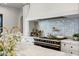 Modern kitchen features a pro range with custom hood and stylish backsplash tiles at 2339 E Virgo Pl, Chandler, AZ 85249