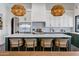 Gourmet kitchen with a large island, marble countertops, stainless steel appliances, and green cabinets, perfect for entertaining at 2339 E Virgo Pl, Chandler, AZ 85249