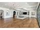 Spacious living room with a fireplace, built-ins, and stylish herringbone floors at 2339 E Virgo Pl, Chandler, AZ 85249
