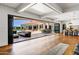 Indoor/outdoor living space with bi-fold doors opening to the pool and patio area at 2339 E Virgo Pl, Chandler, AZ 85249