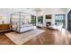 Primary bedroom with a fireplace, herringbone floors, and outdoor access at 2339 E Virgo Pl, Chandler, AZ 85249