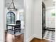 Home office featuring a black desk, chair, and statement chandelier near a modern bathroom at 2339 E Virgo Pl, Chandler, AZ 85249