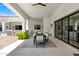 Spacious outdoor dining area featuring a long table, bar, and seamless access to the backyard at 2339 E Virgo Pl, Chandler, AZ 85249