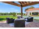Relaxing outdoor seating area offers shade, plush seating, and a view of the pool and backyard at 2339 E Virgo Pl, Chandler, AZ 85249