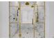 Walk in shower with gold fixtures and marble tile at 2339 E Virgo Pl, Chandler, AZ 85249