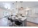 Beautiful kitchen with island seating and modern pendant lighting, perfect for entertaining at 23676 W Parkway Dr, Buckeye, AZ 85326