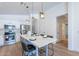 Kitchen featuring a modern island with seating and stainless steel appliances at 23676 W Parkway Dr, Buckeye, AZ 85326