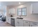 Elegant kitchen featuring stainless steel appliances, quartz countertops, and an open layout at 23676 W Parkway Dr, Buckeye, AZ 85326