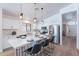 Bright kitchen featuring stainless steel appliances and a stylish island with seating at 23676 W Parkway Dr, Buckeye, AZ 85326