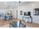 Open-concept living area with a modern kitchen island and ample natural light at 23676 W Parkway Dr, Buckeye, AZ 85326