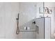 Modern tiled shower with black hardware and built in bench at 23676 W Parkway Dr, Buckeye, AZ 85326