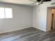 Bedroom featuring new flooring and a walk-in closet at 244 E Ponderosa Ln, Phoenix, AZ 85022