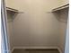 Walk-in closet with rods for hanging clothes at 244 E Ponderosa Ln, Phoenix, AZ 85022