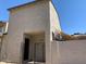 Two-story home with a gated front patio and shade sail at 244 E Ponderosa Ln, Phoenix, AZ 85022