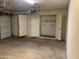 This is a spacious garage with ample storage space and an adjacent utility area at 244 E Ponderosa Ln, Phoenix, AZ 85022
