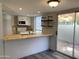 Kitchen with breakfast bar and backyard access at 244 E Ponderosa Ln, Phoenix, AZ 85022