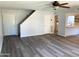 Open living room with wood-look floors and stairs at 244 E Ponderosa Ln, Phoenix, AZ 85022