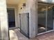 Gated patio with exterior lighting and sliding glass door at 244 E Ponderosa Ln, Phoenix, AZ 85022